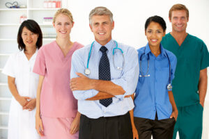 five medical staff smiling
